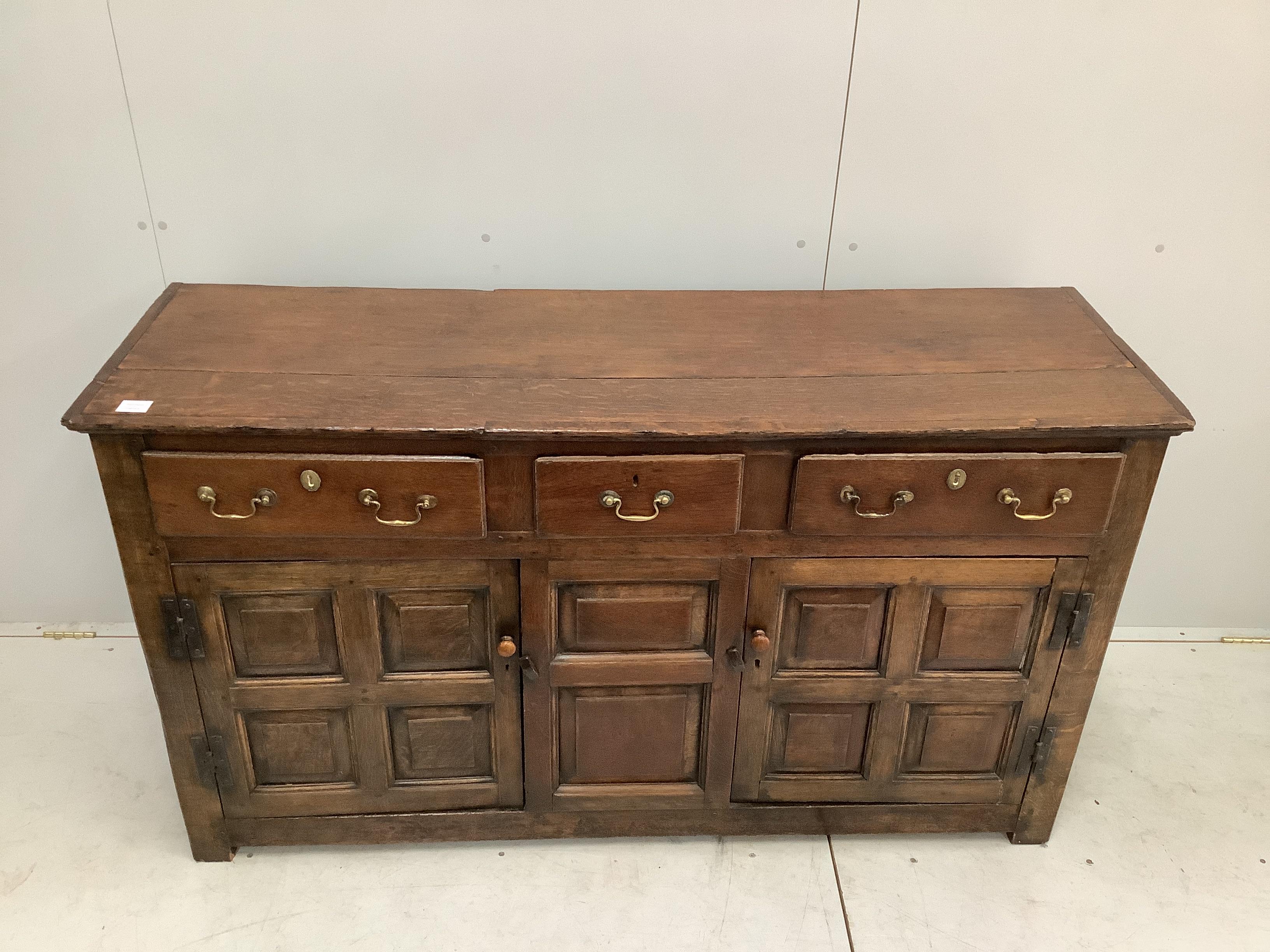 An 18th century oak low dresser, width 155cm, depth 48cm, height 86cm.